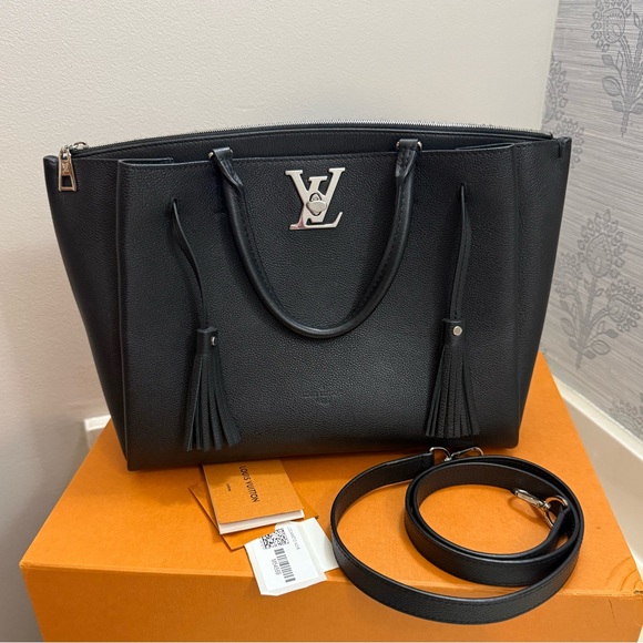 Louis Vuitton Handbags - Louis Vuitton Black Pebbled Leather Tote with Silver LV Accent and Tassels
